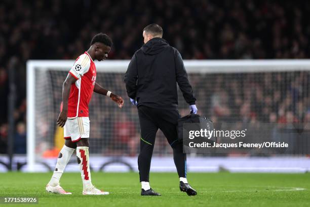 Bukayo Saka of Arsenal is taken off with an injury during the UEFA Champions League match between Arsenal FC and Sevilla FC at Emirates Stadium on...