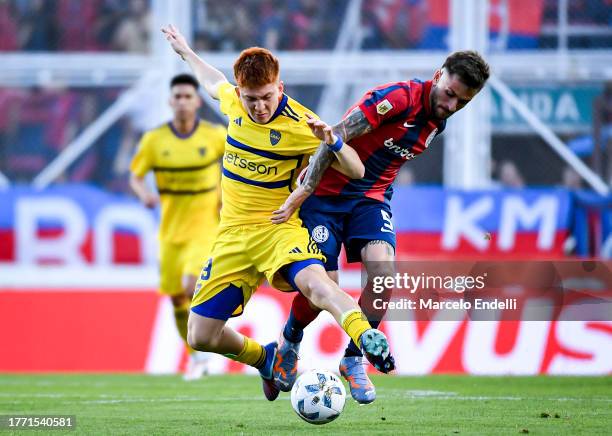 Valentin Barco of Boca Juniors competes for the ball with Jalil Elias of San Lorenzo during a match between San Lorenzo and Boca Juniors as part of...