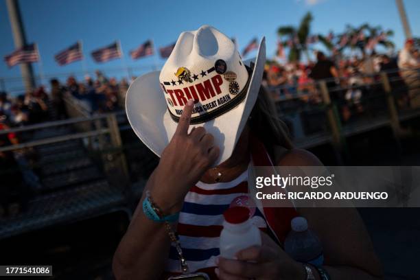 Supporters arrive to hear former US President and 2024 Republican Presidential hopeful Donald Trump speak at a rally at Ted Hendricks Stadium at...