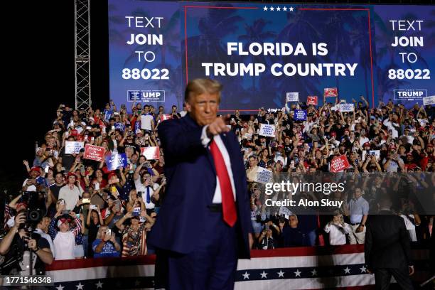 Former U.S. President Donald Trump stands on stage during a rally at The Ted Hendricks Stadium at Henry Milander Park on November 8, 2023 in Hialeah,...