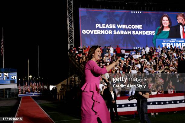 Arkansas Gov. Sarah Huckabee Sanders walks on stage during a rally for former President Donald Trump at The Ted Hendricks Stadium at Henry Milander...