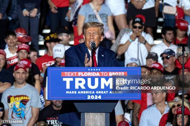 Former US President and 2024 Republican Presidential hopeful Donald Trump speaks during a rally at Ted Hendricks Stadium at Henry Milander Park in...