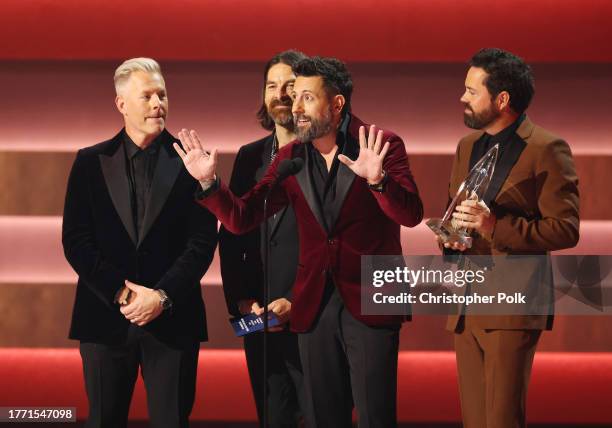 Trevor Rosen, Matthew Ramsey and Brad Tursi of Old Dominion accept the award for Vocal Group of the Year onstage at The 57th Annual CMA Awards at...