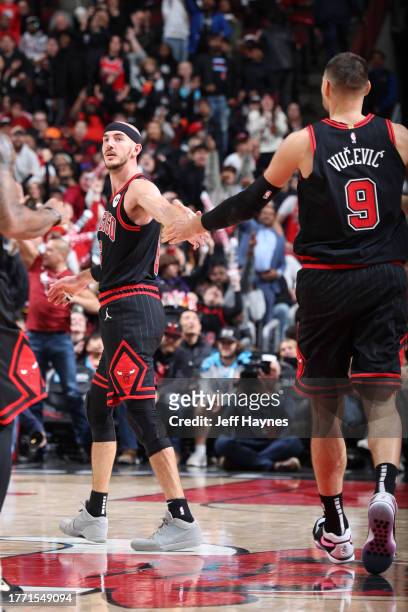 Alex Caruso of the Chicago Bulls and Nikola Vucevic of the Chicago Bulls celebrate during the game against the Phoenix Suns on November 8, 2023 at...