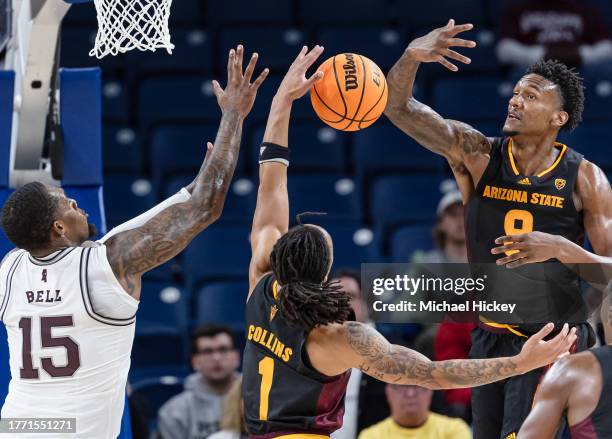 Jimmy Bell Jr. #15 of the Mississippi State Bulldogs reaches for the rebound against Frankie Collins of the Arizona State Sun Devils and Shawn...