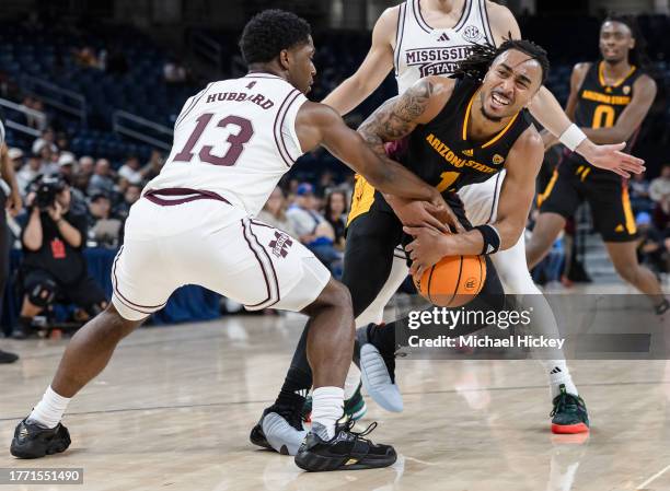 Josh Hubbard of the Mississippi State Bulldogs reaches for the ball against Frankie Collins of the Arizona State Sun Devils during the second half in...