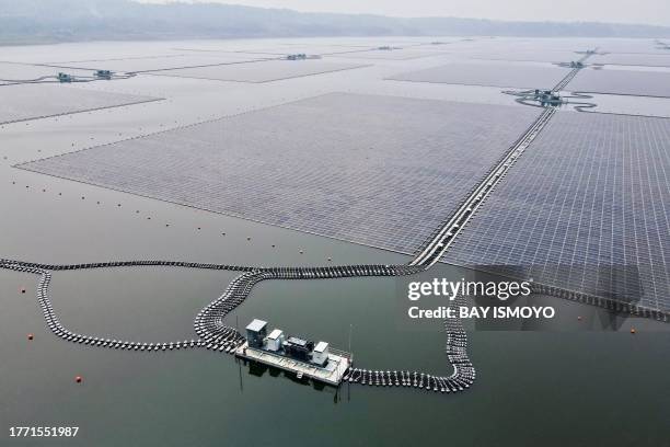This aerial picture shows the newly built floating solar power plant on the water that can generate 192 mega watts of peak electricity in cooperation...