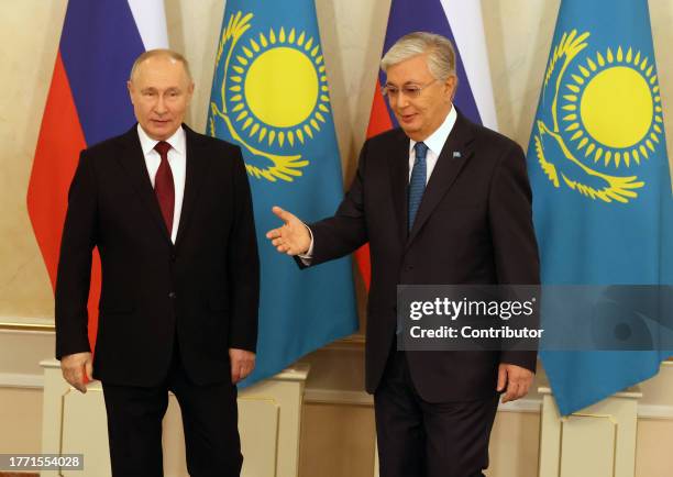 Kazakh President Kassym-Jomart Tokayev greets Russian President Vladimir Putin during their meeting at the Ak Orda Presidential Palace, November 9,...