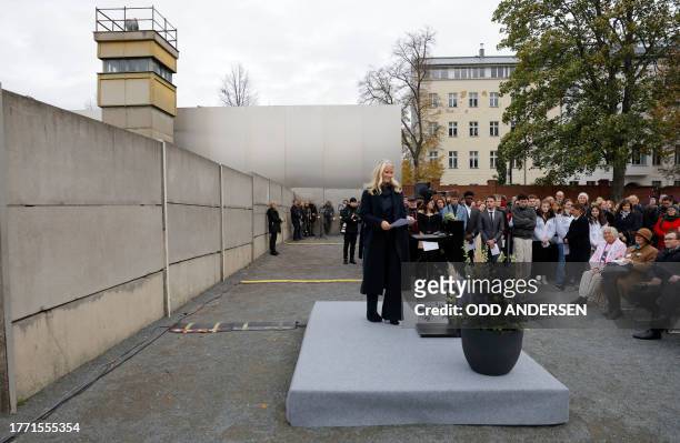 Crown Princess Mette-Marit of Norway steps on the podium to give a speech as she attends festivities at the Berlin Wall Memorial, a 1,5 kilometers...