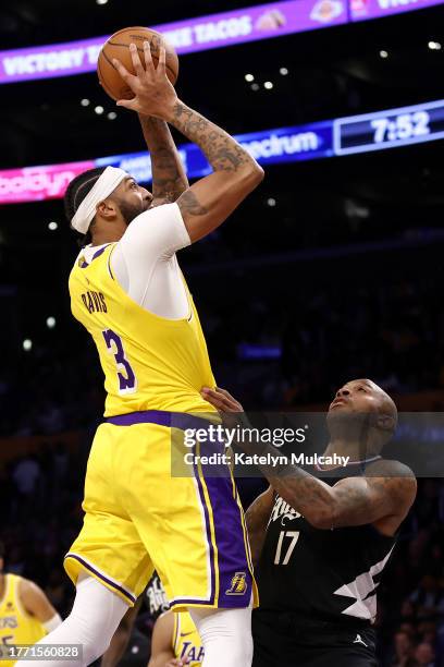 Anthony Davis of the Los Angeles Lakers shoots the ball against P.J. Tucker of the Los Angeles Clippers during the second quarter at Crypto.com Arena...