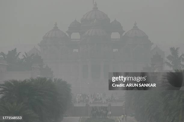 The Akshardham temple is seen amid heavy smog conditions in New Delhi on November 9, 2023. The Indian capital is regularly ranked as one of the most...