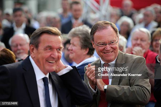 German former Chancellor Gerhard Schroeder and Prime Minister of Lower Saxony Stephan Weil are pictured during an election campaign trail stop on...