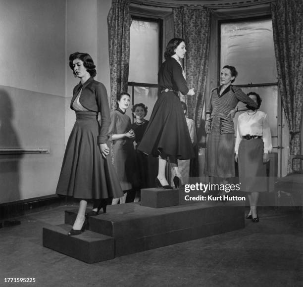 Women learning how to walk and turn on a high, narrow rostrum in a modelling class at a school, which caters for aspiring models, as well as women...