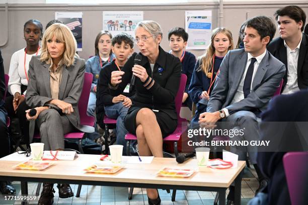 French first lady Brigitte Macron French Education and Youth Minister Gabriel Attal and French Prime Minister Elisabeth Borne address pupils during...