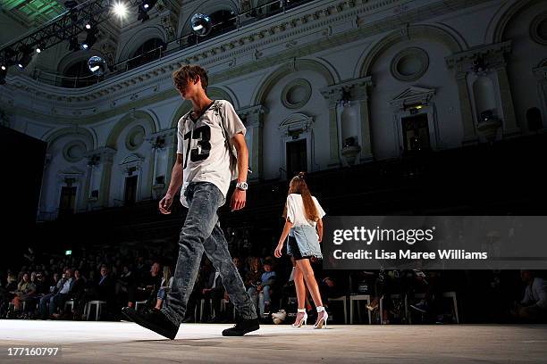 Models showcase designs by General Pants Co. On the runway at the General Pants show during Mercedes-Benz Fashion Festival Sydney 2013 at Sydney Town...