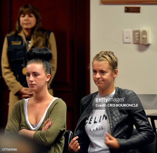Irishwoman Michaella McCollum and Briton Melissa Reid who were arrested at Lima's airport carrying cocaine in their luggage, are seen after a short...