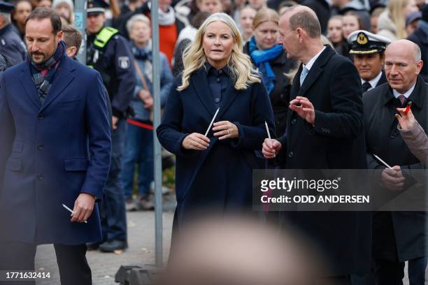 Crown Prince Haakon of Norway and Crown Princess Mette-Marit of Norway walk with Axel Klausmeier , director of the Berlin Wall Foundation, and...
