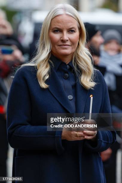 Crown Princess Mette-Marit of Norway lights a candle at the Berlin Wall Memorial, a 1,5 kilometers stretch on the former border strip between East...