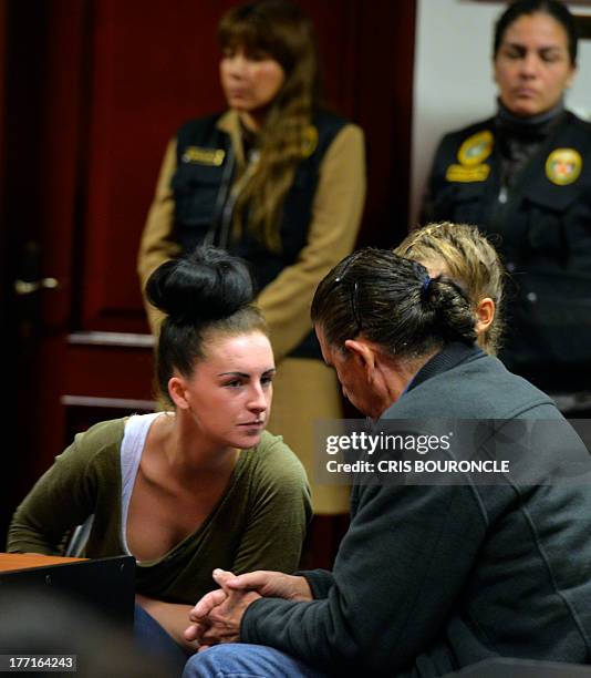 Irishwoman Michaella McCollum and Briton Melissa Reid who were arrested at Lima's airport carrying cocaine in their luggage, listen to a...