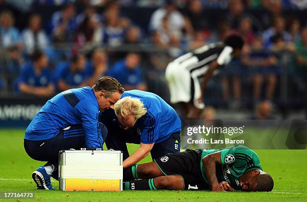 Jefferson Farfan of Schalke lies injured on the pitch during the UEFA Champions League Play-off first leg match between FC Schalke 04 and PAOK...