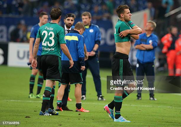 Christian Fuchs and Adam Szalai of Schalke look dejected after the UEFA Champions League Play-off first leg match between FC Schalke 04 and PAOK...