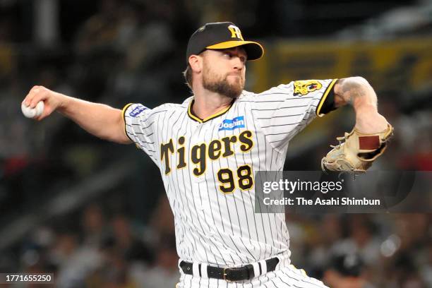 Colten Brewer of the Hanshin Tigers throws in the 6th inning against Orix Buffaloes during the Japan Series Game Three at Hanshin Koshien Stadium on...