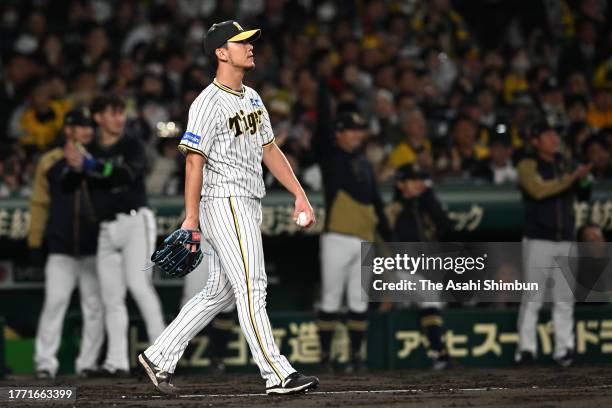 Colten Brewer of the Hanshin Tigers reacts after allowing a sacrifice fly to Kenya Wakatsuki of the Orix Buffaloes in the 6th inning during the Japan...