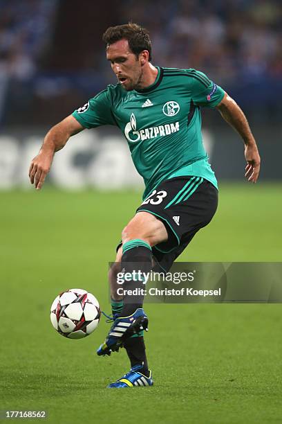 Christian Fuchs of Schalke runs with the ball during the UEFA Champions League Play-off first leg match between FC Schalke 04 and PAOK Saloniki at...