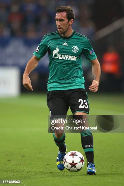 Christian Fuchs of Schalke runs with the ball during the UEFA Champions League Play-off first leg match between FC Schalke 04 and PAOK Saloniki at...