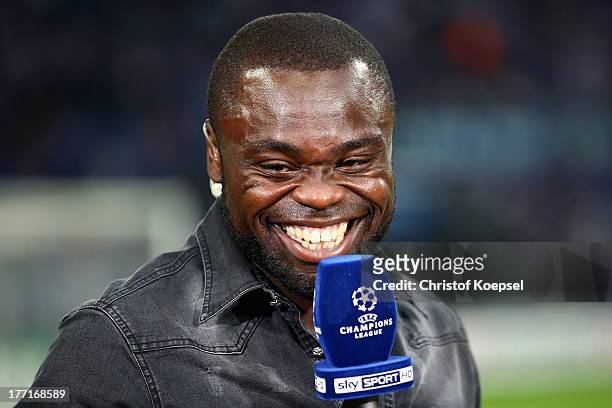 Gerald Asamoah of Schalke speaks to sky television channel prior to the UEFA Champions League Play-off first leg match between FC Schalke 04 and PAOK...