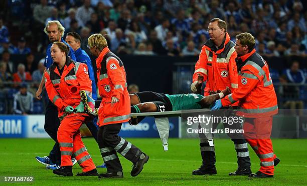 Jefferson Farfan of Schalke lies injured on the pitch during the UEFA Champions League Play-off first leg match between FC Schalke 04 and PAOK...