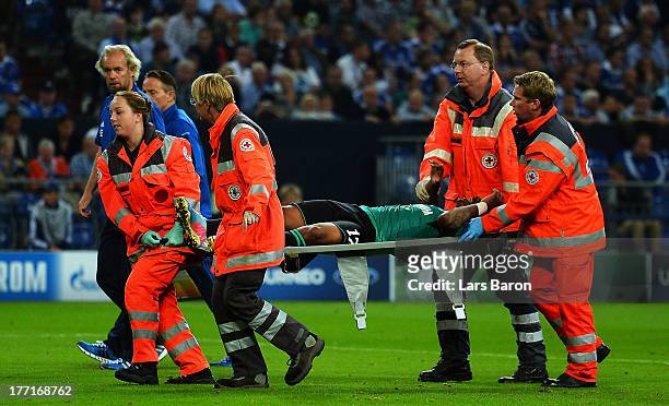 Jefferson Farfan of Schalke lies injured on the pitch during the UEFA Champions League Play-off first leg match between FC Schalke 04 and PAOK...