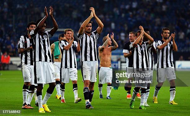 Players of Saloniki celebrate after the UEFA Champions League Play-off first leg match between FC Schalke 04 and PAOK Saloniki at Veltins-Arena on...