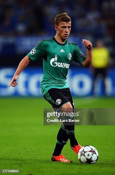 Max Meyer of Schalke runs with the ball during the UEFA Champions League Play-off first leg match between FC Schalke 04 and PAOK Saloniki at...