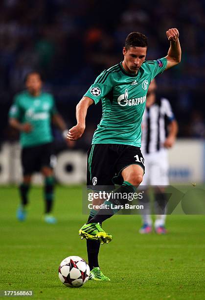 Julian Draxler of Schalke runs with the ball during the UEFA Champions League Play-off first leg match between FC Schalke 04 and PAOK Saloniki at...