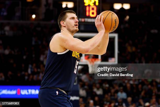 Nikola Jokic of the Denver Nuggets shoots the ball against the Minnesota Timberwolves in the third quarter at Target Center on November 01, 2023 in...