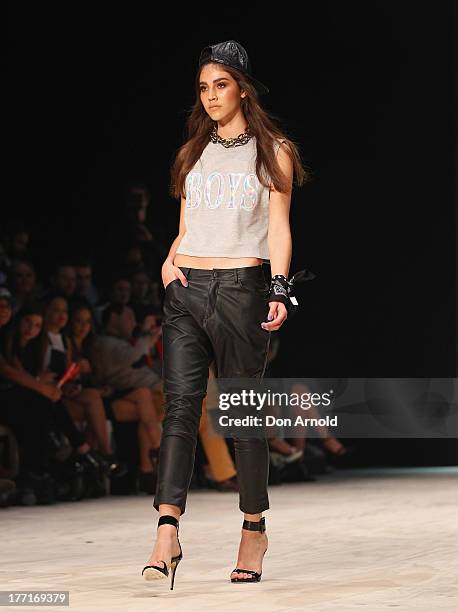 Model showcases designs on the runway at the General Pants show during Mercedes-Benz Fashion Festival Sydney 2013 at Sydney Town Hall on August 21,...