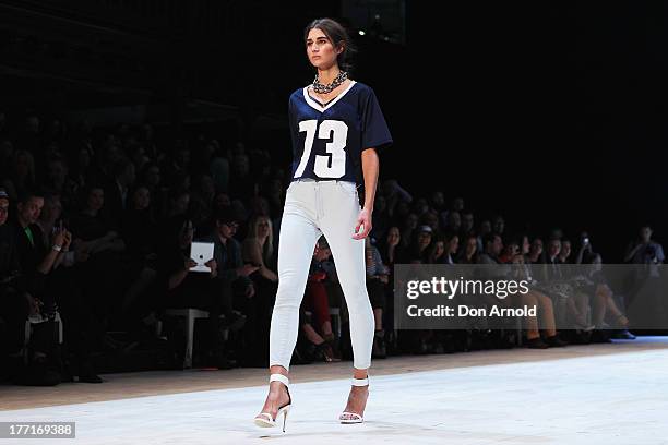 Model showcases designs on the runway at the General Pants show during Mercedes-Benz Fashion Festival Sydney 2013 at Sydney Town Hall on August 21,...