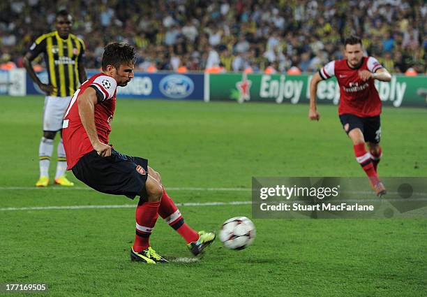 Olivier Giroud scores the 3rd Arsenal goal from the penalty spot during the UEFA Champions League Play Off first leg match between Fenerbache SK and...