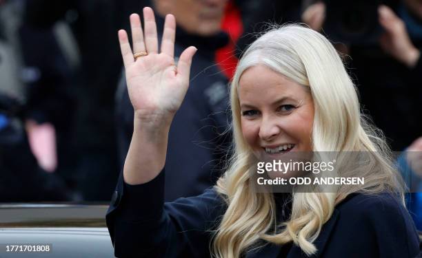 Crown Princess Mette-Marit of Norway waves as she leaves after attending festivities at the Berlin Wall Memorial, a 1,5 kilometers stretch on the...
