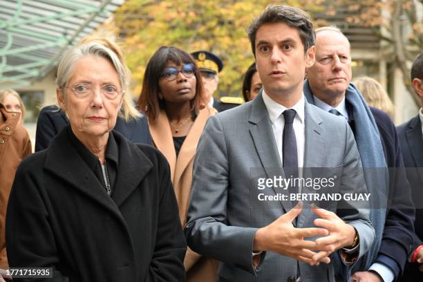 French Education and Youth Minister Gabriel Attal delivers a speech next to French Prime Minister Elisabeth Borne during their visit to a Paris'...