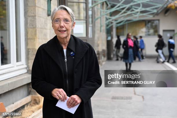 French Prime Minister Elisabeth Borne is seen during her visit to a Paris' middle-school on the theme of school bullying on France's national day...