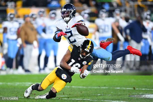 Azeez Al-Shaair of the Tennessee Titans breaks up a pass intended for Calvin Austin III of the Pittsburgh Steelers in the second quarter at Acrisure...