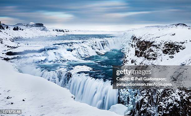 the golden waterfall - gullfoss, southern iceland - gullfoss falls stock-fotos und bilder