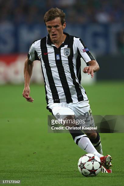 Costin Lazar of Saloniki runs with the ball during the UEFA Champions League Play-off first leg match between FC Schalke 04 and PAOK Saloniki at...