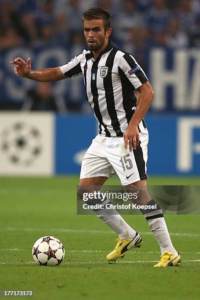 Miguel Vitor of Saloniki runs with the ball during the UEFA Champions League Play-off first leg match between FC Schalke 04 and PAOK Saloniki at...