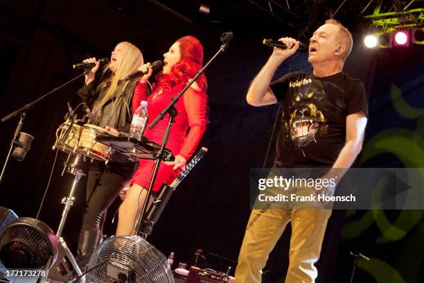 Cindy Wilson, Kate Pierson and Fred Schneider of The B-52's perform live during a concert at the Huxleys on August 21, 2013 in Berlin, Germany.