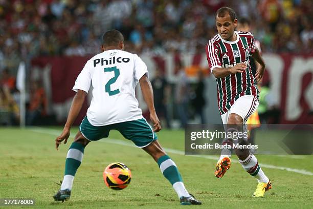 Carlinhos of Fluminense struggles for the ball with Vitor of Goias during a match between Fluminense and Goias as part of Brazilian Cup 2013 at...