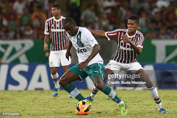 Willians of Fluminense struggles for the ball with Hugo of Goias during a match between Fluminense and Goias as part of Brazilian Cup 2013 at...