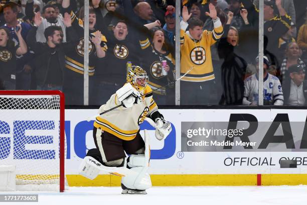 Jeremy Swayman of the Boston Bruins celebrates after blocking a shot from Auston Matthews of the Toronto Maple Leafs to win the game a shootout at TD...